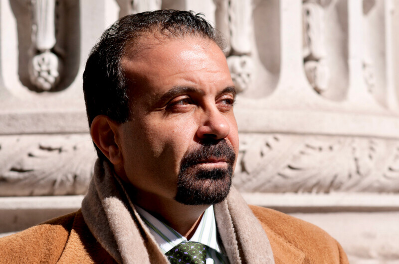 Portrait of Joseph Massad standing in front of neoclassical building