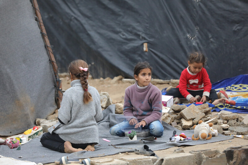 Children play on the ground.