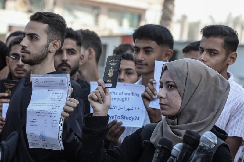 Young people hold up signs in protest