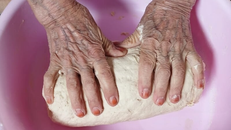 hands kneading dough