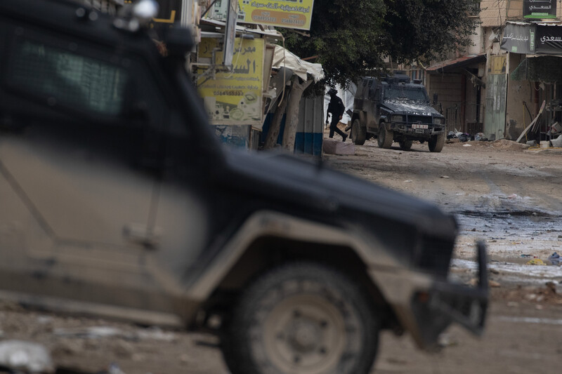 Palestinian security forces take positions in the Jenin refugee camp on 21 December 2024.