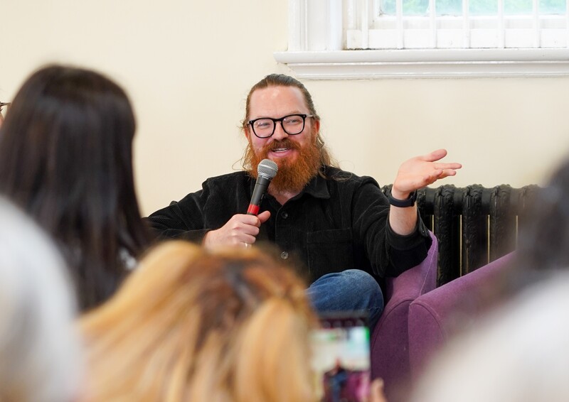 A man speaking into a microphone