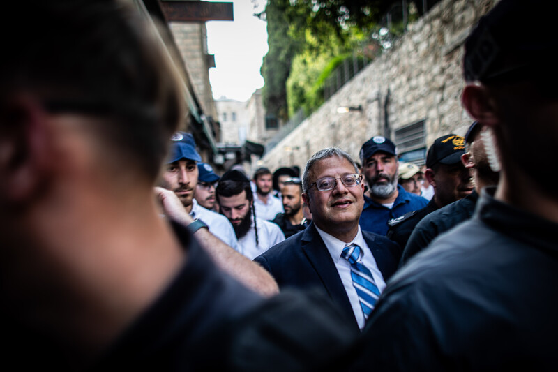 National security minister Itamar Ben-Gvir marches with a crowd through the Muslim Quarter in the Old City of Jerusalem
