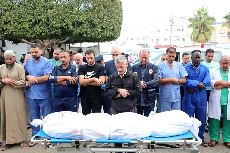 doctors perform funeral rites for a colleague