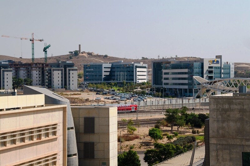 Wide view of modern buildings, some still under construction