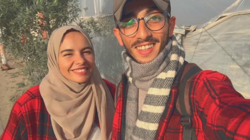 A couple smiles