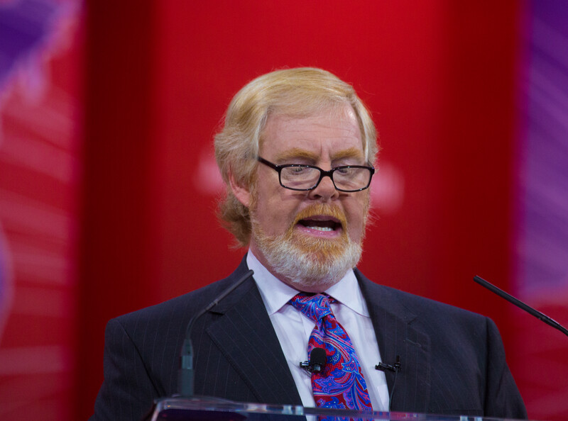 L. Brent Bozell III speaking into microphones