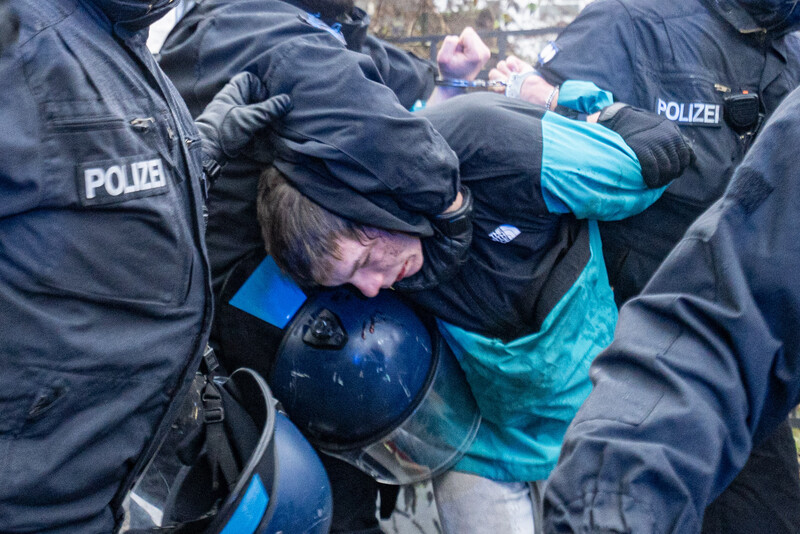 BERLIN, GERMANY - DECEMBER 27: Police detains a demonstrator as protesters march in support of Palestinians after gathering in front of Neukolln City Hall (Rathaus Neukolln) in Berlin, Germany on December 27, 2025.
