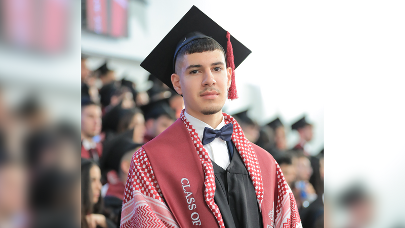 Shadi Khoury at his high school graduation with other students in the background