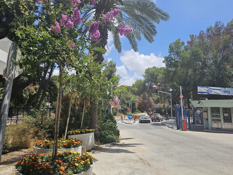 Photo shows the entrance to a kibbutz