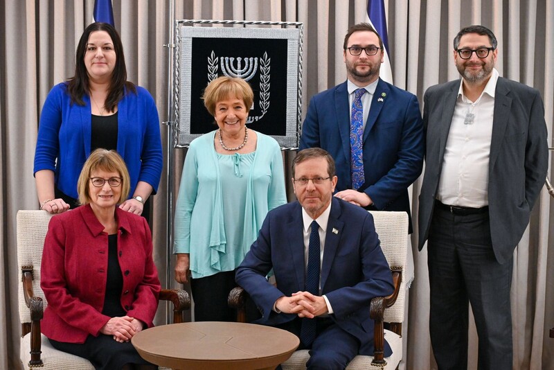 A group of people posing for the camera