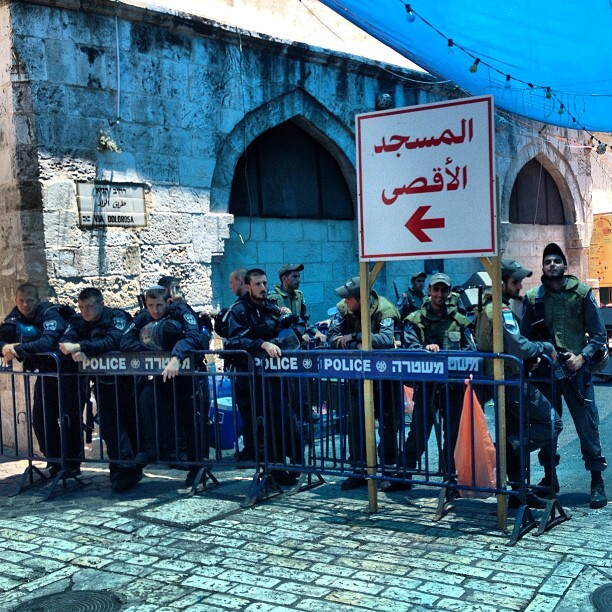 Oh the symbolism of this photo! Israeli apartheid colonialist army standing next to sign directing worshippers to "aqsa mosque" #ramadan #aqsa #jerusalem #palestine Oh the symbolism of this photo! Israeli apartheid colonialist army standing next to sign directing worshippers to "aqsa mosque" #ramadan #aqsa #jerusalem #palestine on Instagram