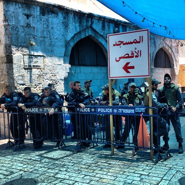 Oh the symbolism of this photo! Israeli apartheid colonialist army standing next to sign directing worshippers to &quot;aqsa mosque&quot; #ramadan #aqsa #jerusalem #palestine on Instagram