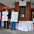 People holding signs