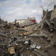 Photo shows I Love Gaza and a heart with a rocket through it spray painted on a pile of rubble