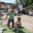 Two girls playing past the debris of homes after Israeli forces demolished them in Khan al-Ahmar. 
