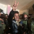 Muhammad Bilal Tamimi smiling, raising a “victory” sign as Israeli occupation soldiers abduct him from his home on 11 January.