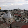 The Dome of the Rock backdrops a Church dome in Jerusalem's Old City. 