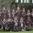 Palestinian schoolchildren in uniform pose for a picture. 