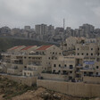 The Israeli settlement of Pisgat Zeev (foreground), and the Palestinian Shuafat refugee camp behind the Israeli separation wall in occupied East Jerusalem. 