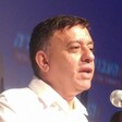Avi Gabbay speaking into a microphone.