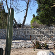 A rock wall displays the name of Pitzer College