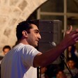 A man speaks at a microphone