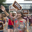 Woman marches in parade