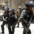 Soldiers carrying rifles