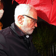 A man under an umbrella in the dark