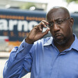 Man adjusts his eyeglasses