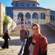 Woman stands outside the Dome of the Rock