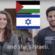 Two people stand side by side with Palestinian and Israeli flags