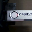 A USB with "Cellebrite" written on it is plugged into a device