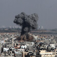 Smoke rises from crowded neighborhood