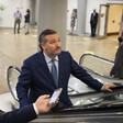 Man ascends escalator