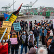 Protesters hold signs 