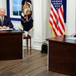 Two men seated at tables