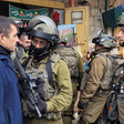 Israeli soldiers confront Palestinian man in Old City of Hebron