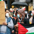 Protesters hold a map of Palestine