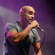 A man on stage holding a microphone