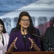 Three people at podium