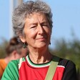 A woman in a Palestinian football shirt