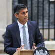 A man speaks from a lectern