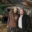 Elisha Yered and Yossi Levi stand inside a structure