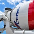 A cement truck with the logo of Cemex