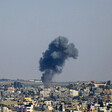 Smoke rising against the Gaza skyline 