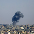 Smoke rising against the Gaza skyline 