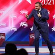 Ted Cruz leans forward and points finger on stage