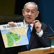 Benjamin Netanyahu holds a map and a red sharpie while standing at the UN General Assembly podium